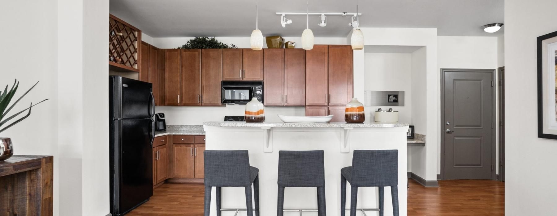 a kitchen with a white table and chairs