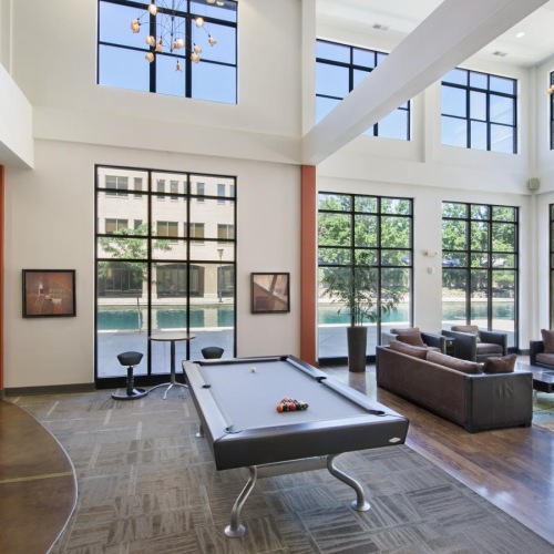 Cutting-edge amenities at your fingertips a room with a pool table, tv and a fireplace