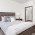 a bed with white pillows