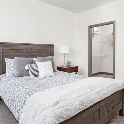 Generous bedroom offerings to fit every family a bed with white pillows