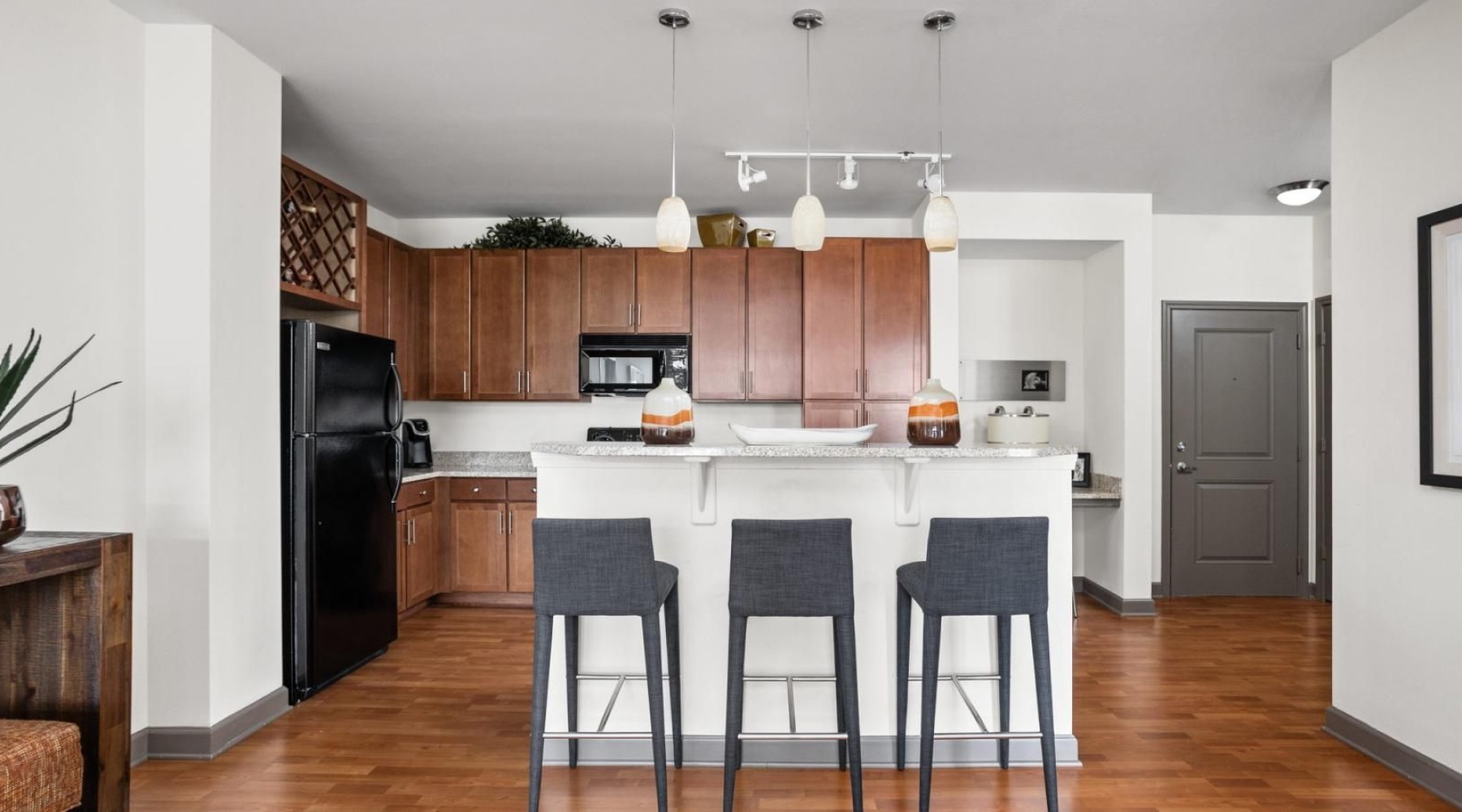 Beautiful kitchens with designer finishes a kitchen with a white table and chairs