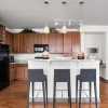 a kitchen with a white table and chairs